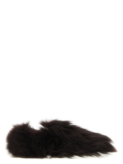 Flat Loafer Slip-On Shoes by Tod's for women in calf & lamb leather brown & signature features an effortless chic silhouette, showcasing the Gommini Women's Calf & Lamb Leather Flat Loafer Slip-On Shoes design with an effortless chic flat and a for a effortless chic look.