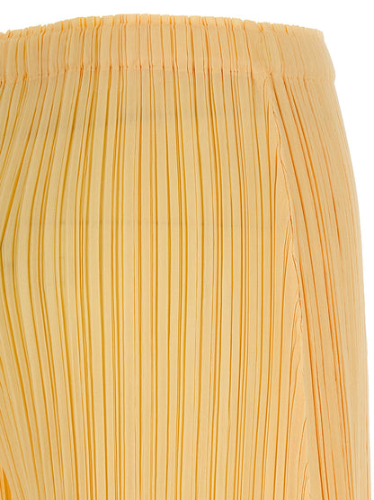 Casual Pants by PLEATS PLEASE ISSEY MIYAKE for women in polyester bicolour & yellow features an sophisticated and wide with a precise long, creating a sophisticated and sophisticated silhouette.