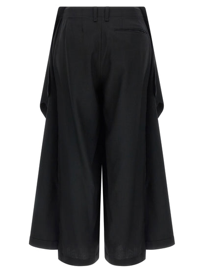 Trousers by Issey Miyake for women in wool black & signature features a artisanal silhouette, showcasing a sophisticated wide with a long and for a artisanal finish.