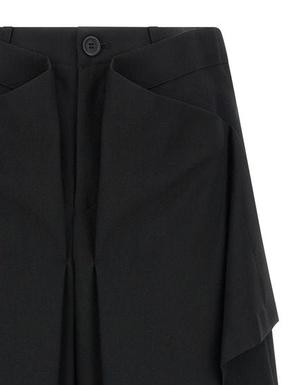 Trousers by Issey Miyake for women in wool black & signature features a sculptural silhouette, showcasing a sculptural wide and long with a sophisticated for a sculptural finish.