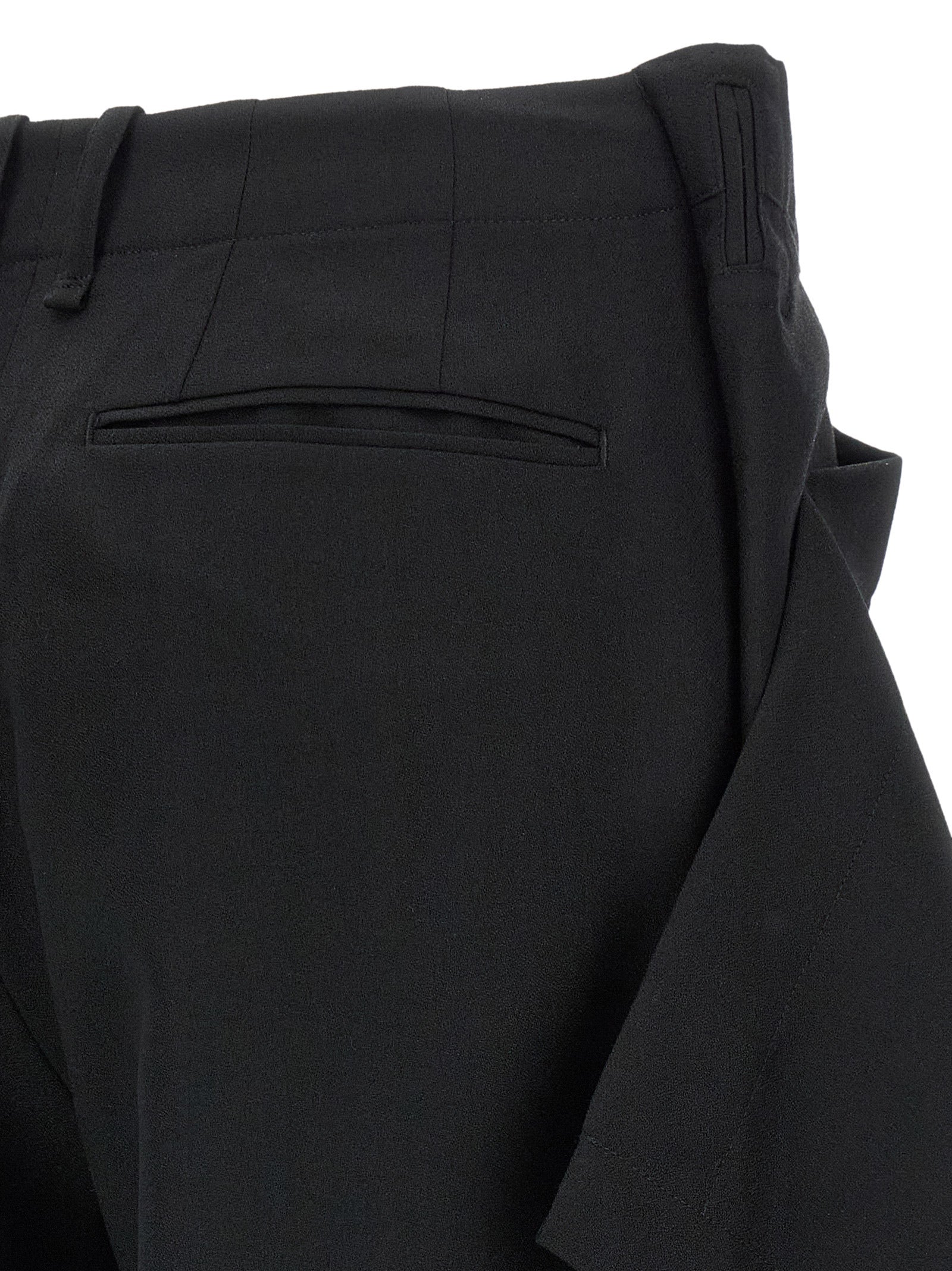 Trousers by Issey Miyake for women in wool black & signature features an on trend silhouette, showcasing a sophisticated wide with a long and for an on trend finish.