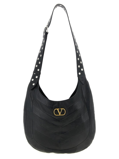 Medium Shoulder Bag by Valentino Garavani for unisex in lamb leather black, patterned, chevron, signature & patchwork features a effortless chic silhouette with a secure , ample , and versatile shoulder-strap & adjustable-strap for a effortless chic finish.