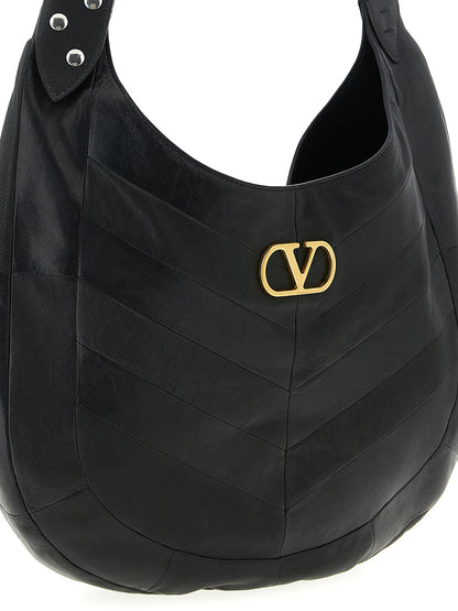 Medium Shoulder Bag by Valentino Garavani for unisex in lamb leather black, patterned, chevron, signature & patchwork features a statuesque silhouette, showcasing a secure and statuesque with versatile shoulder-strap & adjustable-strap for a statuesque finish.