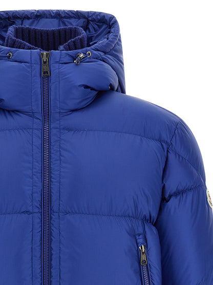This Hooded Puffer Jacket by Moncler for men in polyamide wool & goose-down blue & signature exhibits a edgy silhouette, meticulously detailed with functional hooded & insulated and a edgy hooded high-neck neckline for a edgy finish.