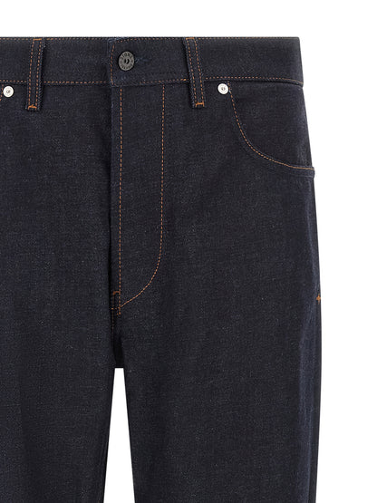 Jeans by Stone Island for men in organic cotton denim blue, indigo & signature presents a tailored silhouette, showcasing a tailored straight-leg and long cut with a refined for a truly tailored aesthetic.