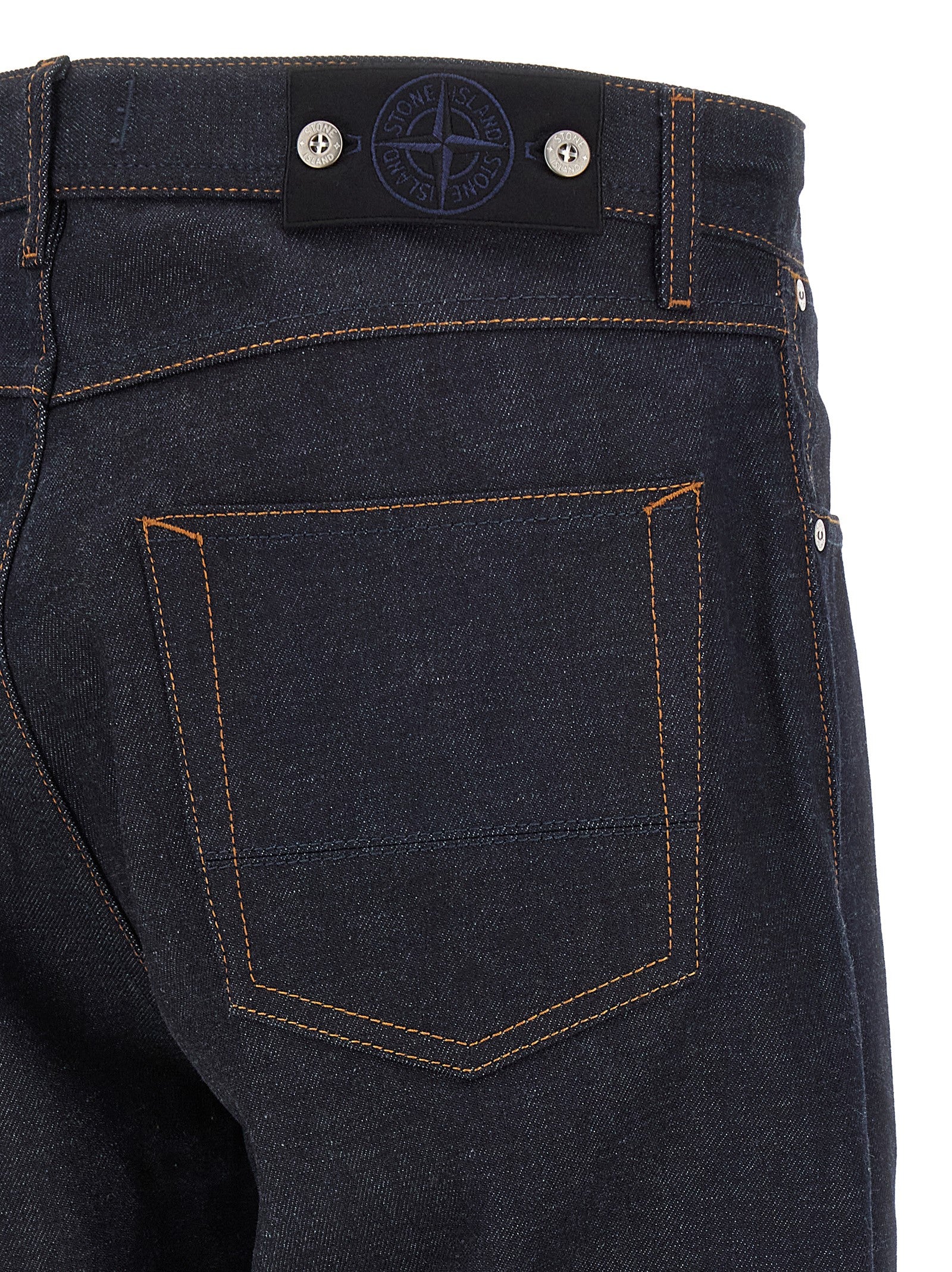 Jeans by Stone Island for men in organic cotton denim blue, indigo & signature features a polished silhouette with a polished straight-leg, reaching a polished long and finished with a polished .