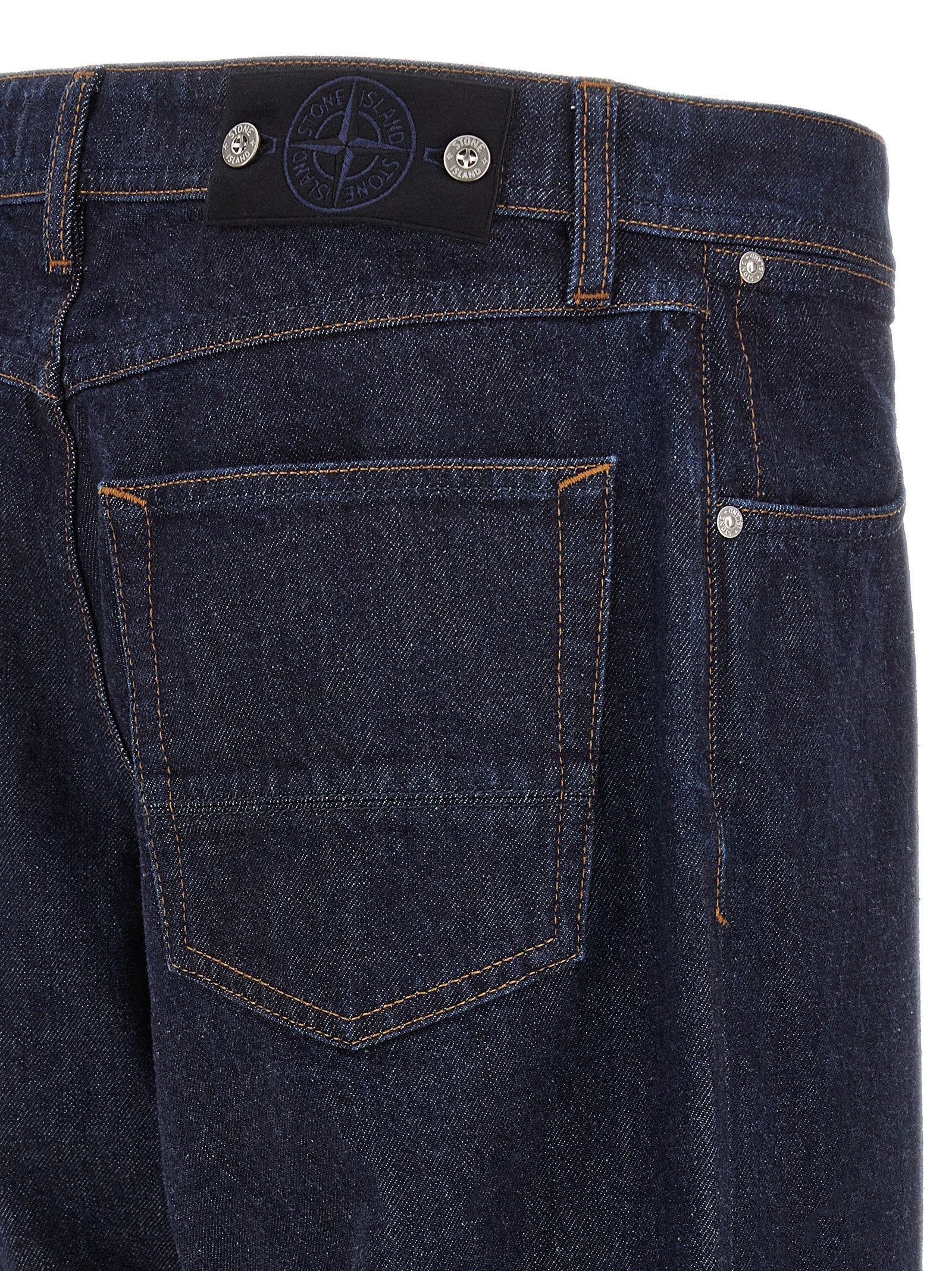 Jeans by Stone Island for men in organic cotton denim blue & indigo features an sophisticated and straight-leg with a precise long, creating a sophisticated and sophisticated silhouette.