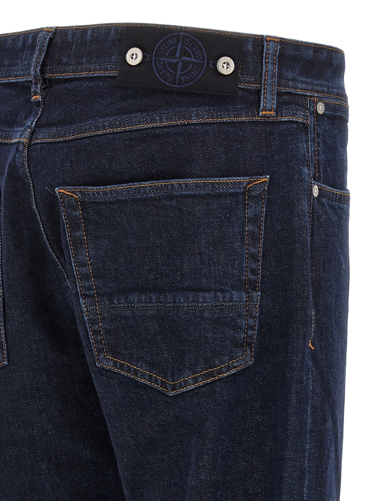 Jeans by Stone Island for men in stretch organic cotton denim blue, indigo & signature presents a tailored silhouette, showcasing a tailored straight-leg and long cut with a refined for a truly tailored aesthetic.