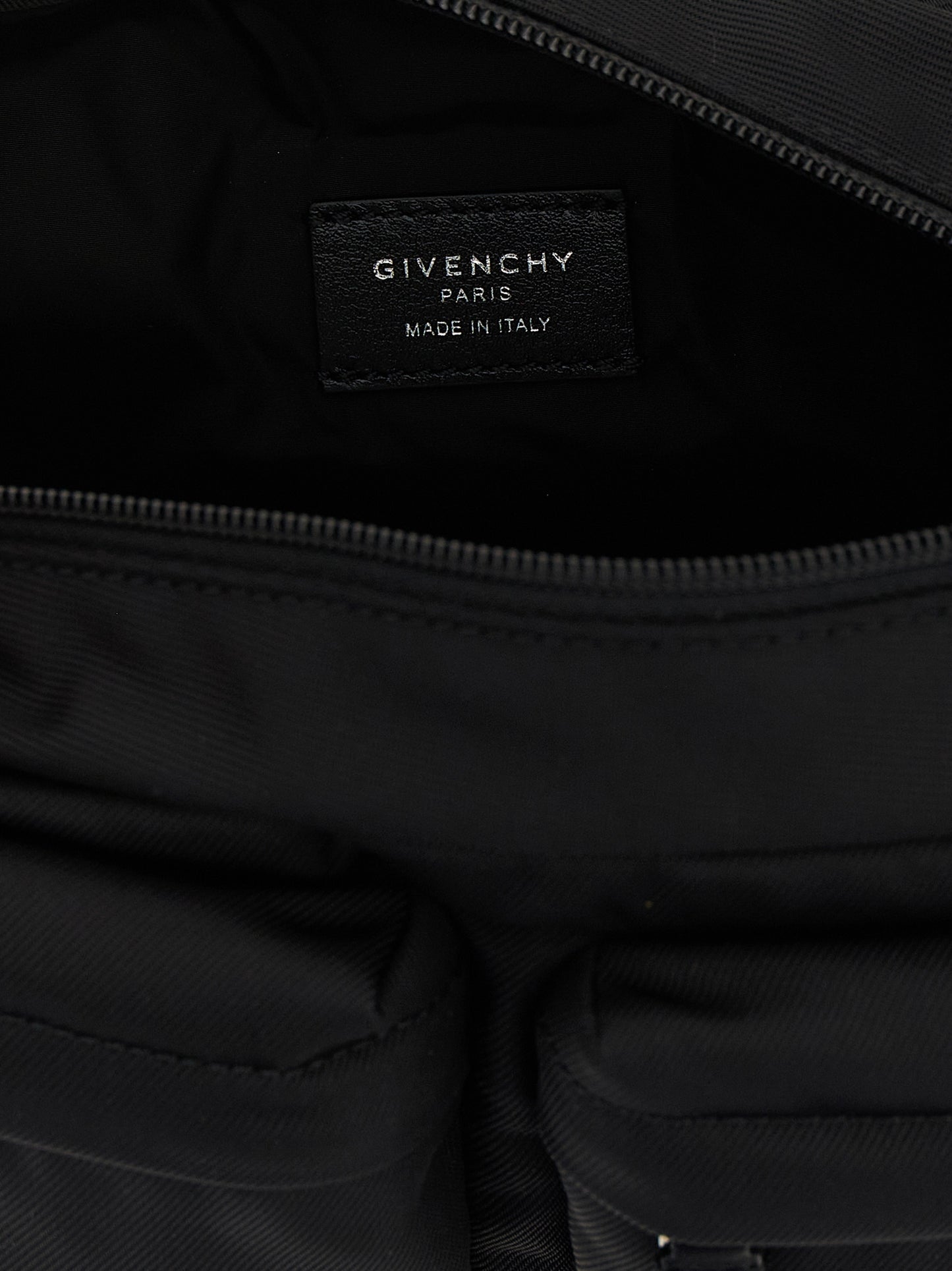 Crossbody Fanny Pack Messenger Bag by Givenchy for men in nylon black showcases a stylish Essential U Nylon Crossbody Fanny Pack Messenger Bag design, featuring a secure zipper and ample with versatile crossbody-strap, shoulder-strap & handle for a stylish look.