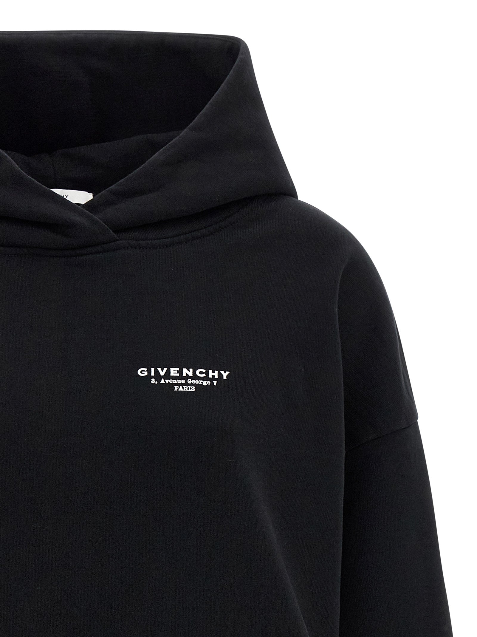 Sweatshirt Hoodie by Givenchy for women in cotton bicolour, black, white & print features a slouchy chic silhouette, detailed with a slouchy chic and a signature hooded neckline for an elevated aesthetic.