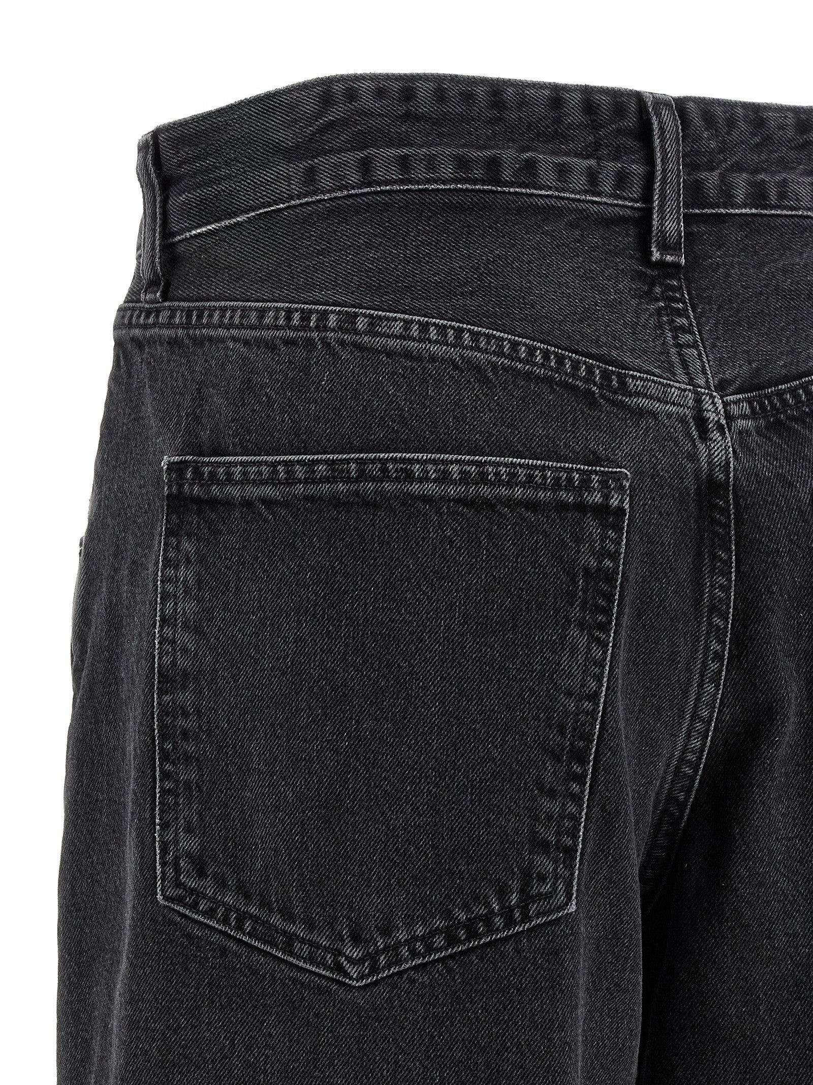 Jeans by Agolde for women in denim cotton black presents a refined pantology silhouette, artfully defined by a refined pantology relaxed-fit & wide, long, and a sophisticated .