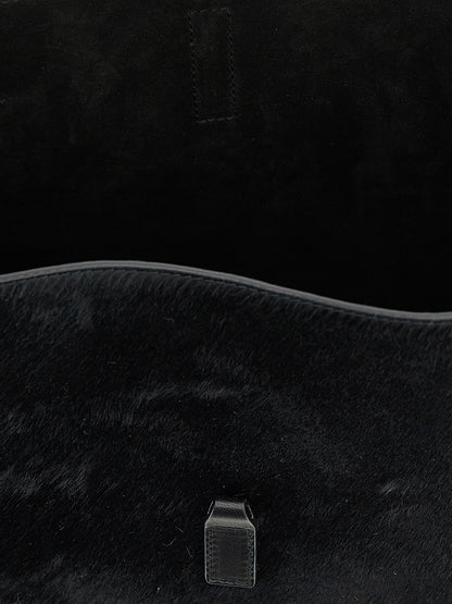 Small Shoulder Bag by Saint Laurent for women in suede calfskin leather black features an effortlessly chic silhouette with a secure , ample , and versatile shoulder-strap, adjustable-strap & handle for effortlessly chic everyday luxury.