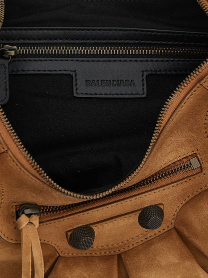 Shoulder Crescent Bag by Balenciaga for women in zamak brass canvas & suede calf leather brown features a effortless chic silhouette with a secure zipper, ample , and versatile shoulder-strap, adjustable-strap & handle for a effortless chic finish.