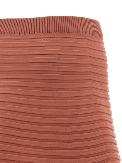 Skirt by PLEATS PLEASE ISSEY MIYAKE for women in polyester multicolor, pink & patterned features a captivating silhouette, showcasing the captivating Icon Women's Pleated Flared Polyester Skirt design with a sophisticated midi for a captivating look.