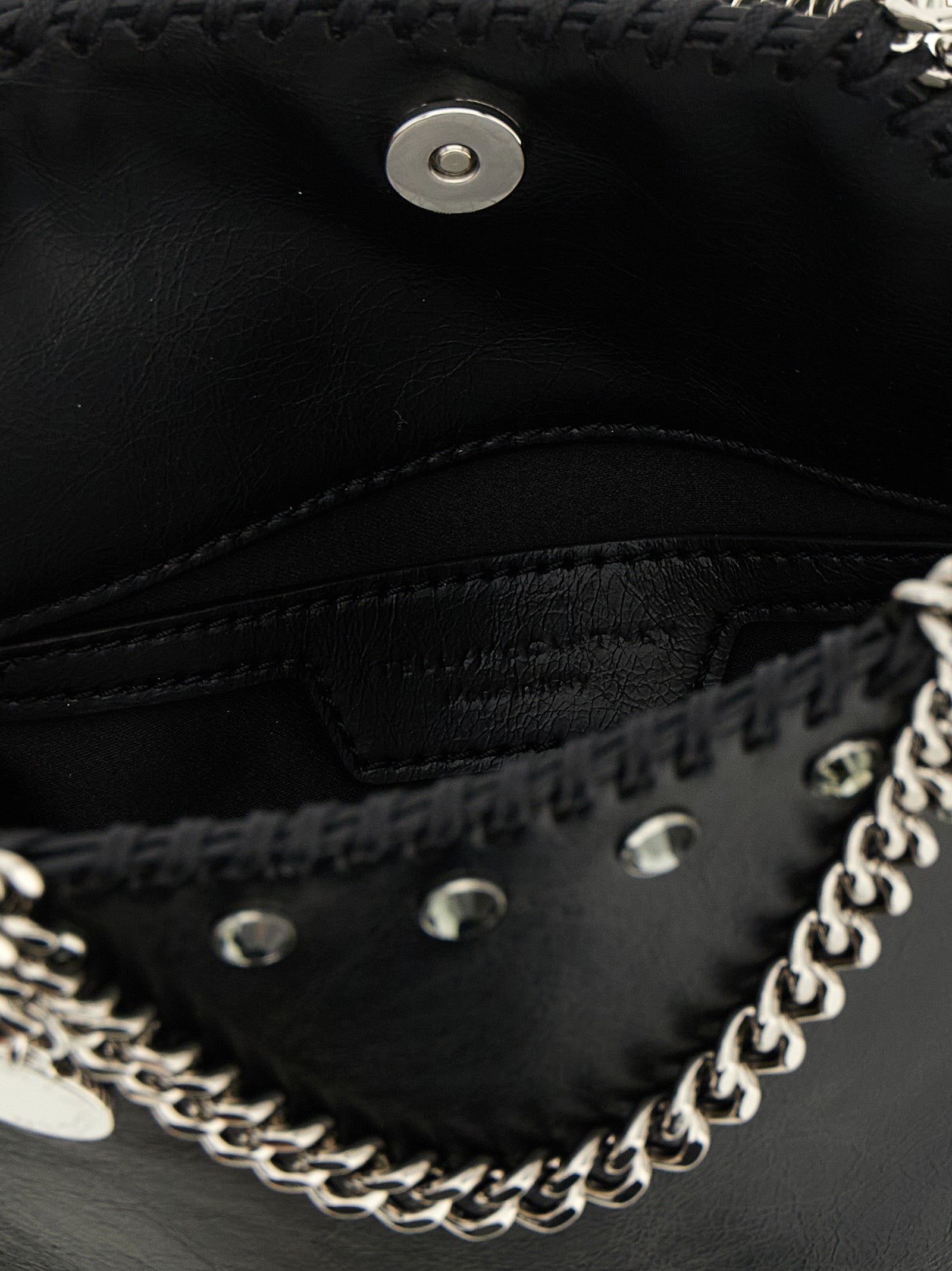 Handbag by Stella McCartney for women in exotic leather & crystal black features an refined silhouette, showcasing a secure magnetic, ample , and versatile shoulder-strap & handle for a sophisticated refined aesthetic.