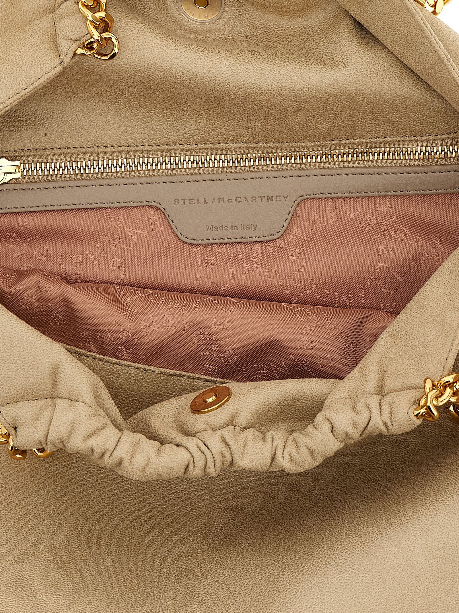Shoulder Drawstring Bag by Stella McCartney for women in polyester beige, gold & signature showcases a statuesque silhouette, artfully detailed with a secure drawstring & magnetic, organized , and versatile shoulder-strap & handle for a statuesque look.