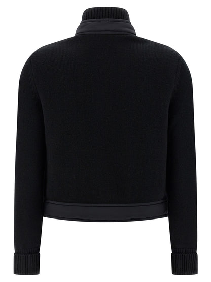 Cardigan by Moncler Grenoble for women in polyamide wool black features an impeccable silhouette, showcasing a sophisticated high-neck neckline and detail for a truly impeccable finish.