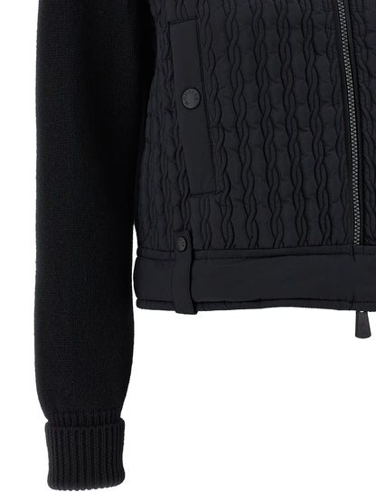 Cardigan by Moncler Grenoble for women in polyamide wool black showcases a captivating silhouette, artfully detailed with a captivating and for a truly sophisticated captivating look.