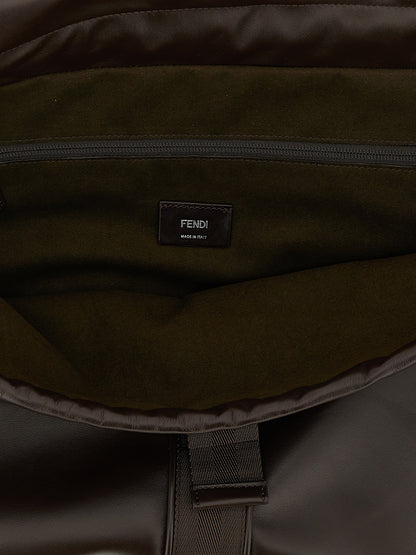 This Messenger Handbag by Fendi for unisex in calfskin leather and brown presents a sculptural silhouette featuring a secure flap & drawstring, ample , and versatile shoulder-strap, adjustable-strap, detachable-strap & handle for a sculptural finish.