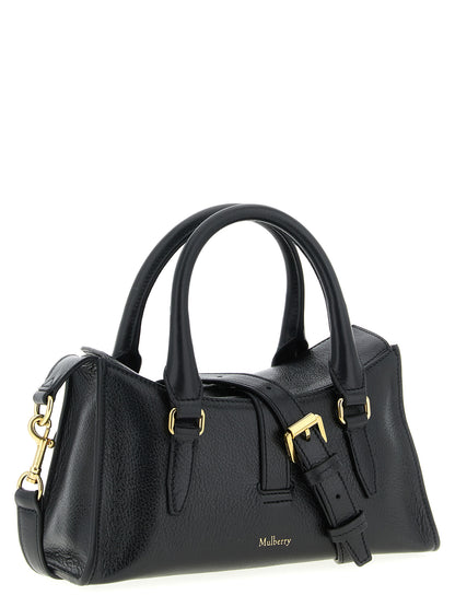 This Mini Flap Handbag by Mulberry for women in calfskin leather and black presents a sculptural silhouette featuring a secure flap & magnetic, ample , and versatile shoulder-strap, adjustable-strap & handle for a sculptural finish.