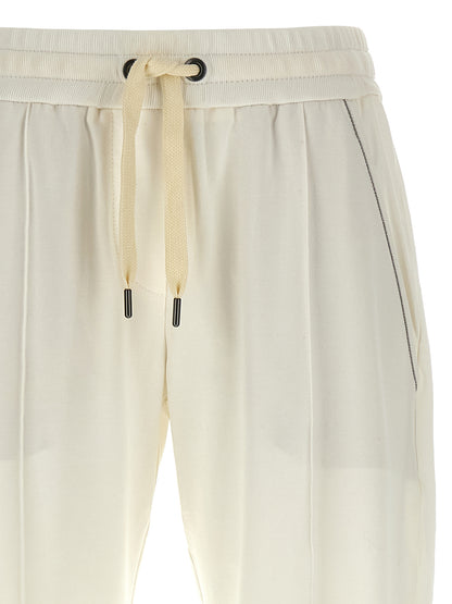 Joggers by Brunello Cucinelli for women in stretch cotton white & signature features a polished silhouette with a polished relaxed-fit, reaching a polished long and finished with a polished .