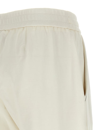 Joggers by Brunello Cucinelli for women in stretch cotton white & signature features a refined silhouette with a refined relaxed-fit, defined by a and a refined long for a refined finish.