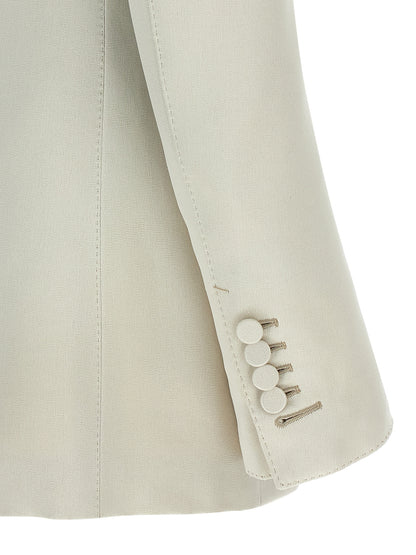 This Blazer by Tom Ford for women in silk cotton & cupro beige presents a tailored silhouette, meticulously tailored with a tailored and distinctive for a tailored finish.