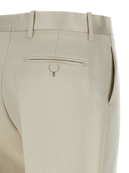 Trousers by Tom Ford for women in cotton & silk beige features a tailored silhouette with a tailored straight-leg, defined by its long and a sophisticated .