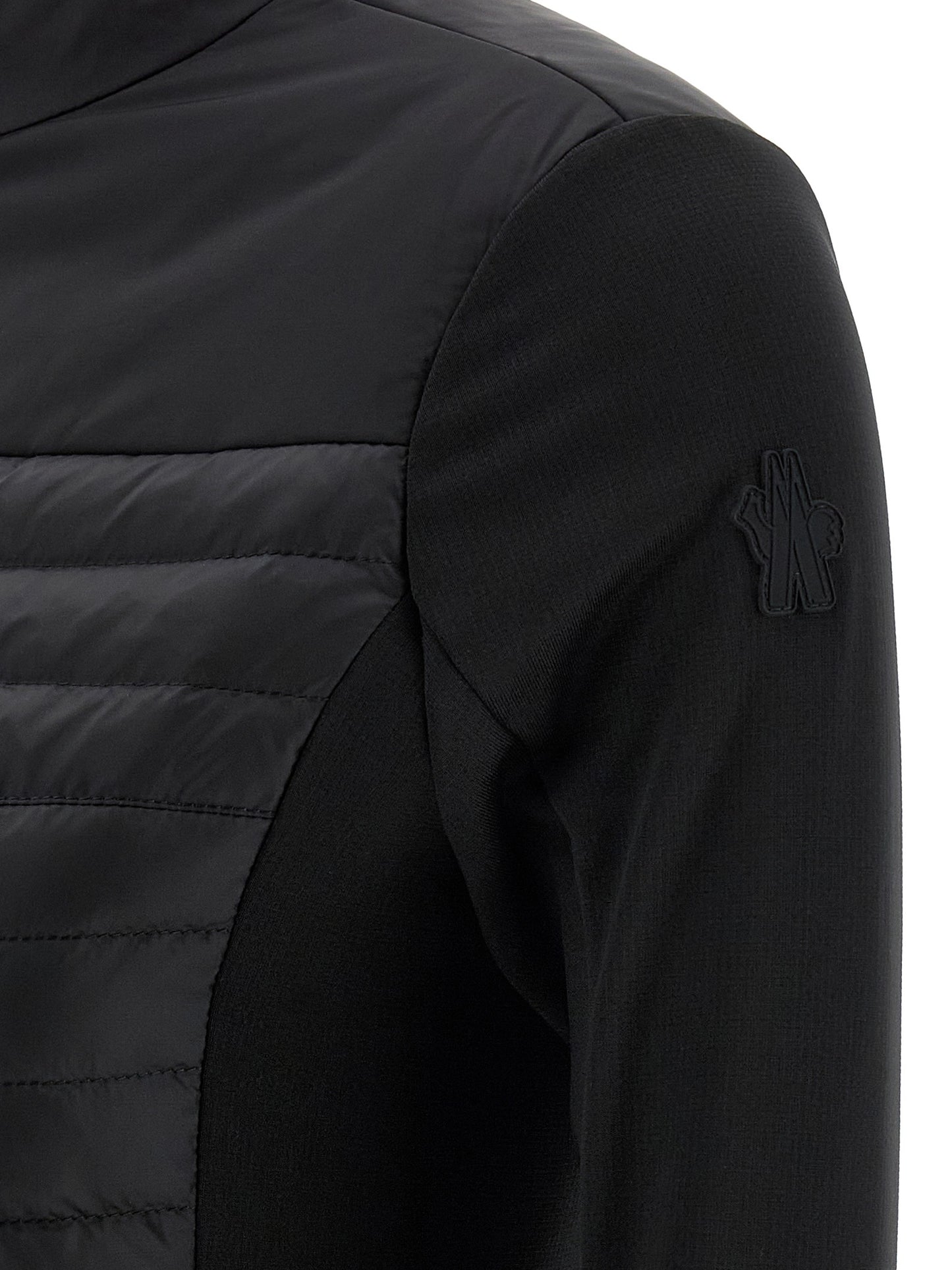 Cardigan by Moncler Grenoble for women in nylon & silicone black presents a textural silhouette, artfully finished with a textural and for a sophisticated, textural look.