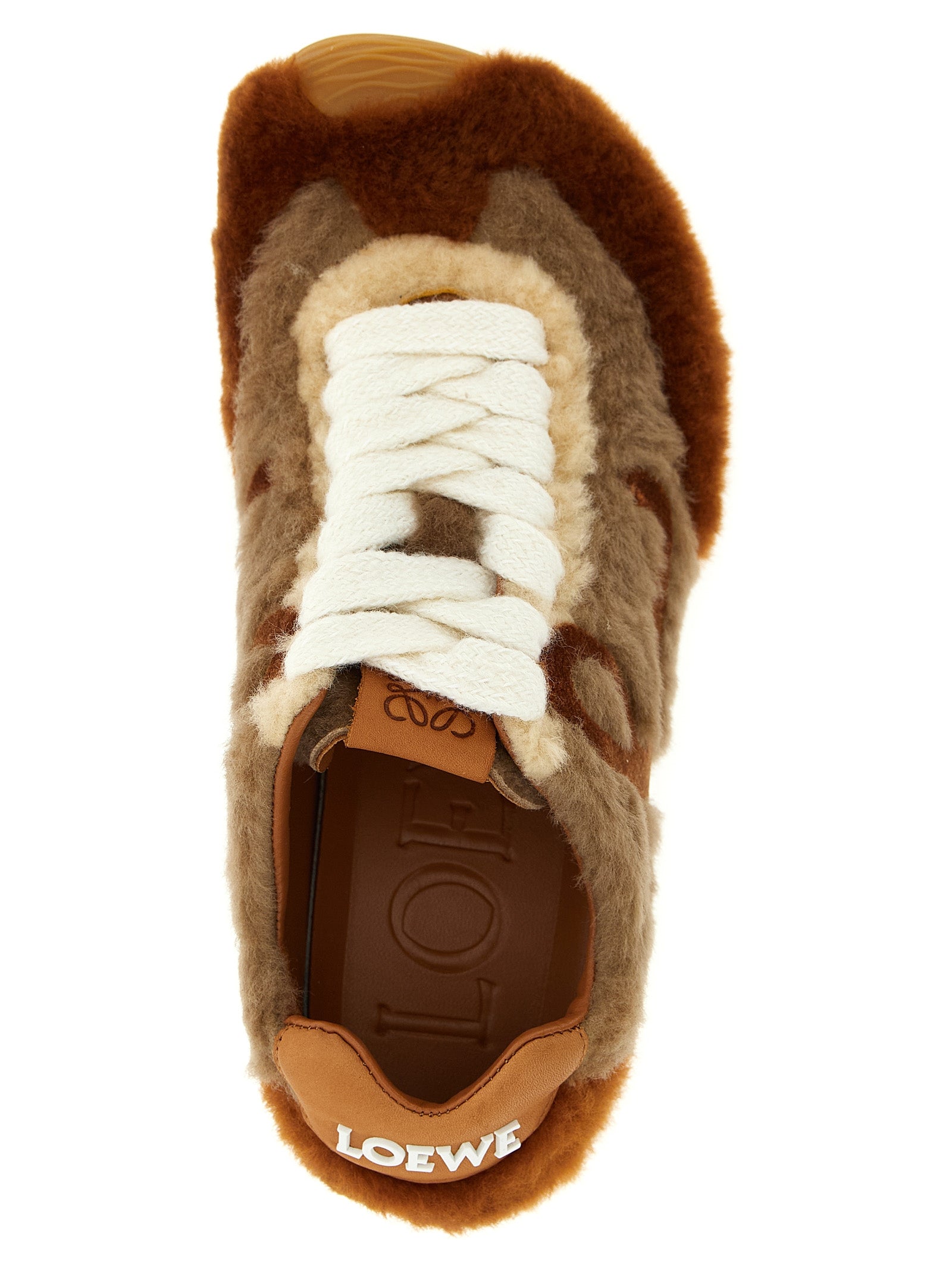 Sneakers by Loewe for women in plush polyester velvet & lamb leather brown presents a sumptuous silhouette, artfully capturing the essence of the Women's Low Top Sock Plush Polyester Velvet & Lamb Leather Sneakers with its sumptuous low-top sock style design.