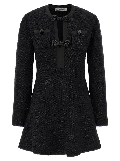 Dress by Self-Portrait for women in cotton polyester wool & sequins black showcases a striking silhouette, elegantly detailed with a , refined crew neckline, and a striking short mini for a striking finish.