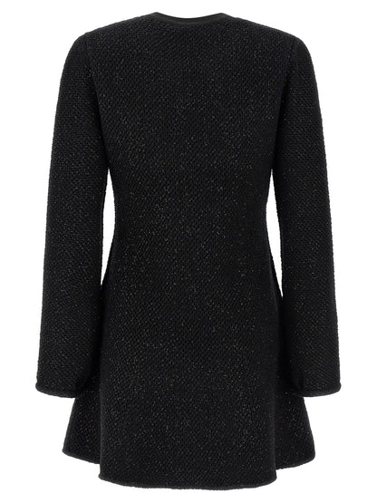 Dress by Self-Portrait for women in cotton polyester wool & sequins black features a dramatic silhouette, showcasing an elegant crew neckline and that flows into a dramatic short mini.