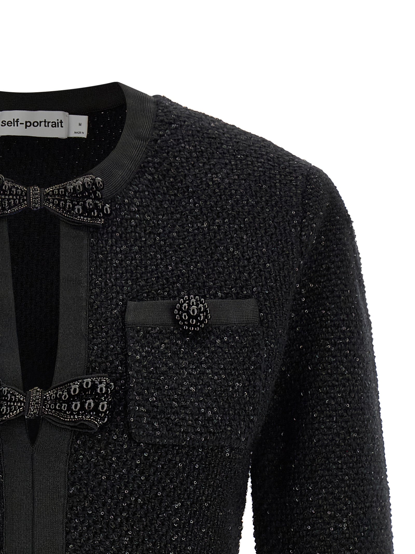 Dress by Self-Portrait for women in cotton polyester wool & sequins black features an magnificent silhouette, artfully detailed with a magnificent crew neckline and that flows into an magnificent short mini.