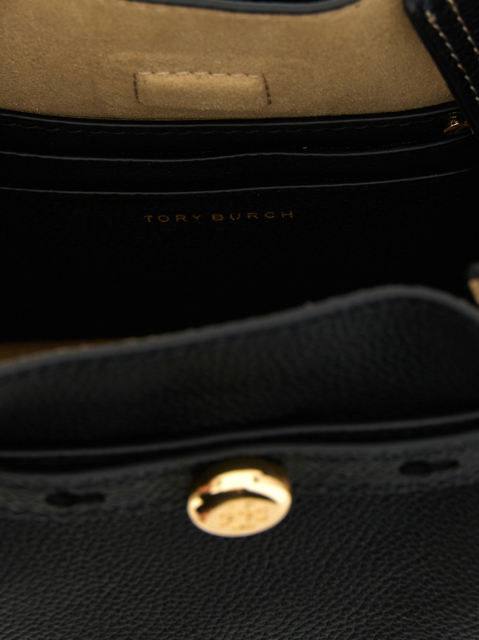 Crossbody Bucket Handbag by Tory Burch for women in suede leather black features a transformative elegance silhouette, showcasing a secure magnetic, organized , and versatile crossbody-strap, shoulder-strap, adjustable-strap, belt-strap & handle for a transformative elegance look.