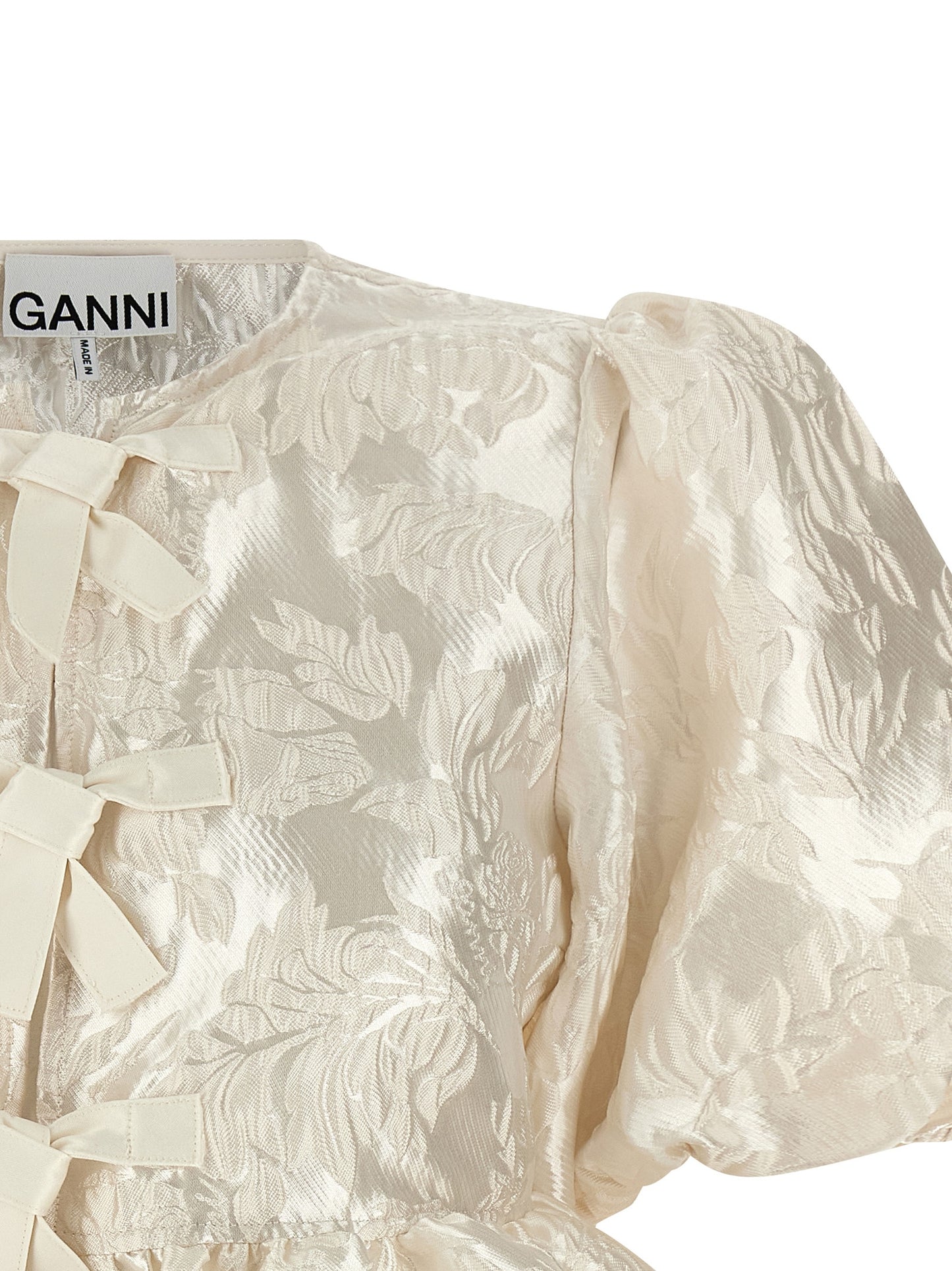 Blouse by Ganni for women in polyamide polyester satin white & jacquard showcases a sharp silhouette, elegantly detailed with a sharp crew neckline and sharp .