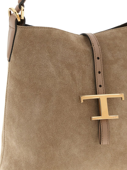 Mini Bucket Handbag by Tod's for women in calfskin leather beige features an refined silhouette, showcasing a secure snap, ample , and versatile shoulder-strap, adjustable-strap & handle for a sophisticated refined aesthetic.