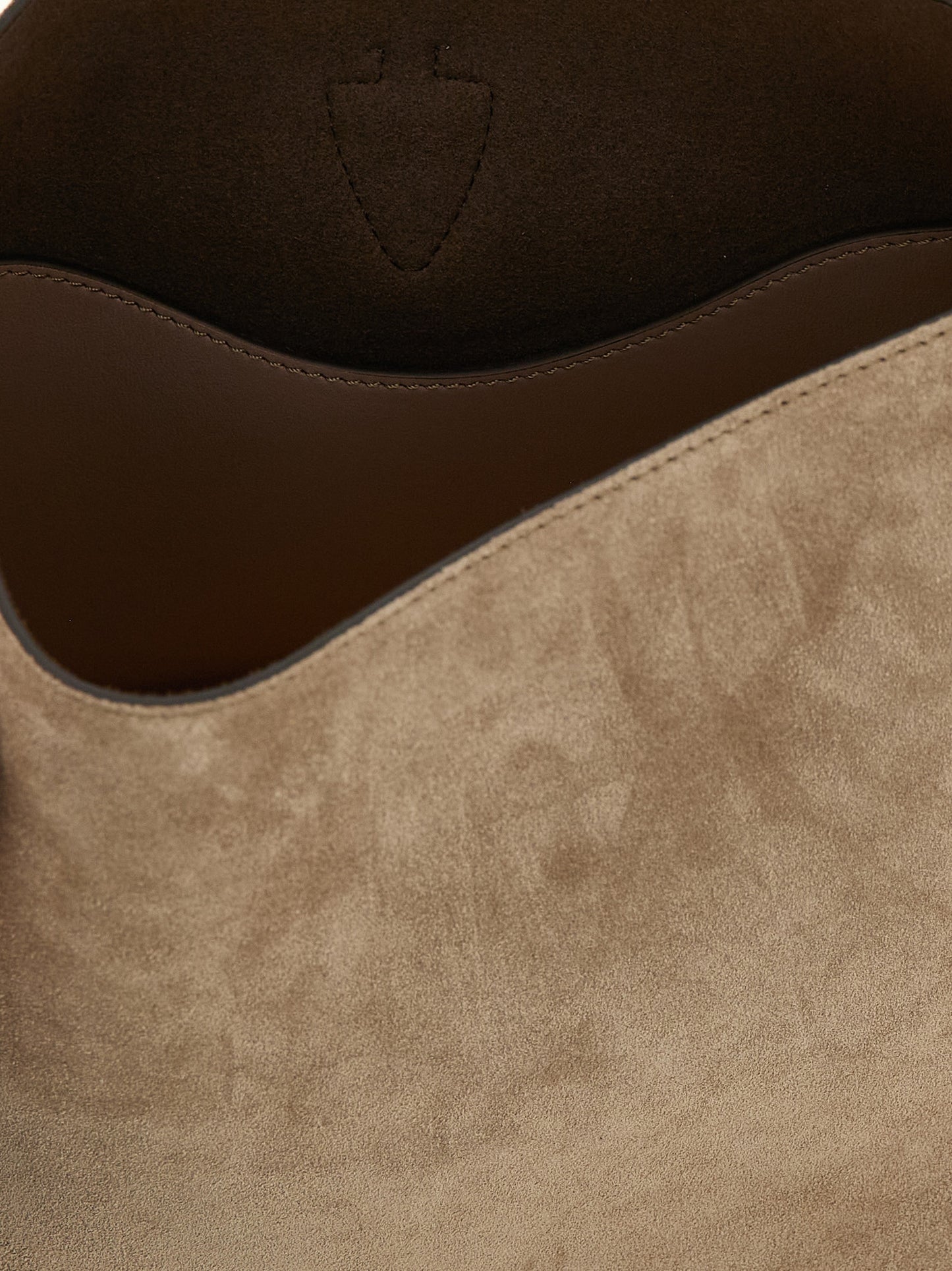 Mini Bucket Handbag by Tod's for women in calfskin leather beige features a exquisite silhouette, showcasing a secure snap and exquisite with versatile shoulder-strap, adjustable-strap & handle for a exquisite finish.