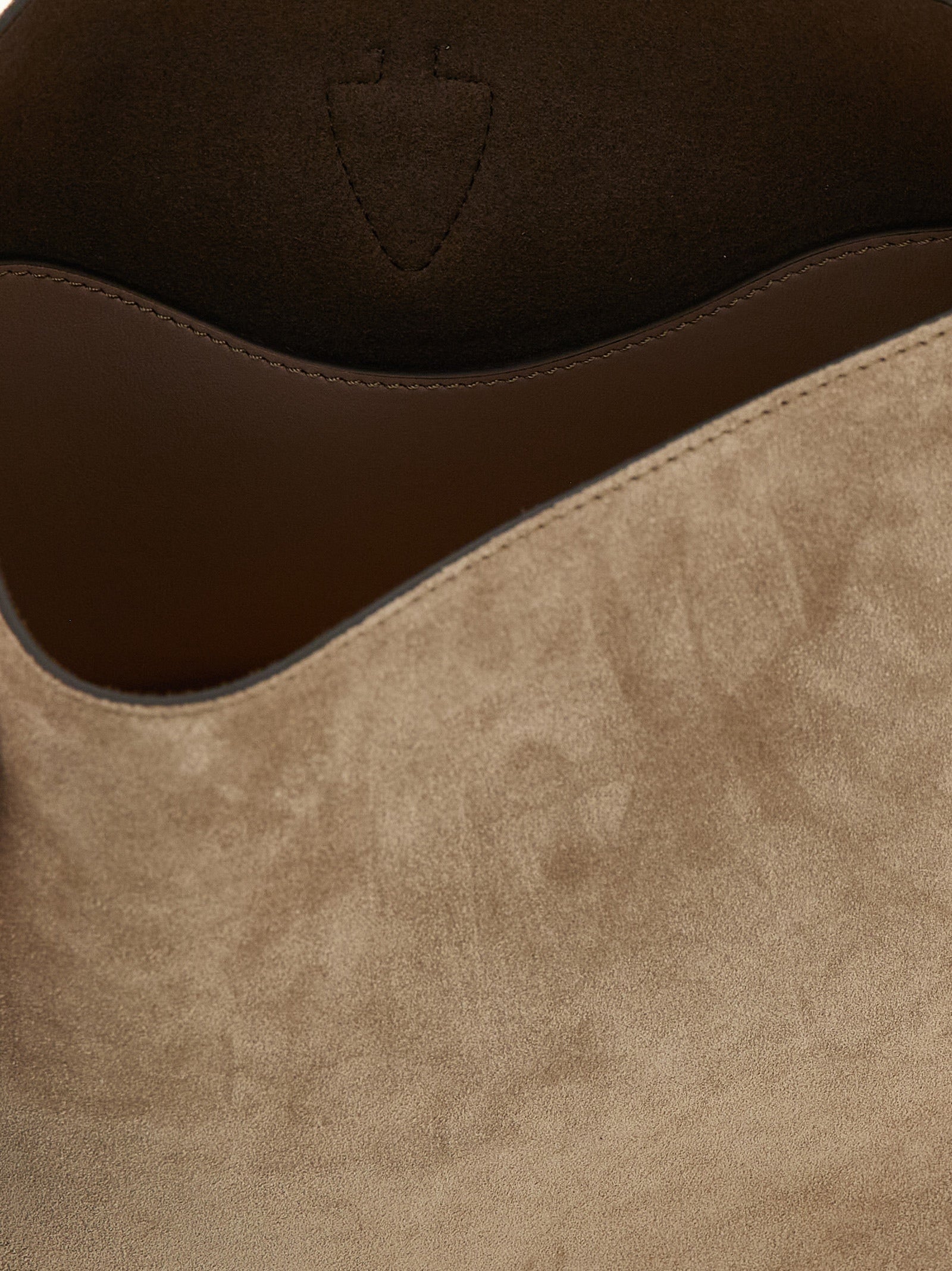 Mini Bucket Handbag by Tod's for women in calfskin leather beige features a exquisite silhouette, showcasing a secure snap and exquisite with versatile shoulder-strap, adjustable-strap & handle for a exquisite finish.