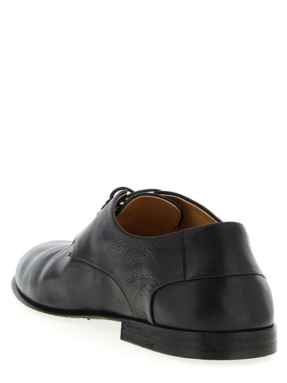 Derby Lace-Up Shoes by Marsell for men in calfskin leather black showcases a timeless silhouette from the Men's Calfskin Leather Derby Lace-Up Shoes collection, featuring a timeless and for a timeless finish.