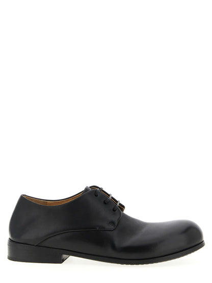 Derby Shoes by Marsell for men in bos taurus calfskin leather black showcases a impeccable silhouette as Men's Bos Taurus Calfskin Leather Derby Shoes, artfully designed with a impeccable and refined for a impeccable finish.