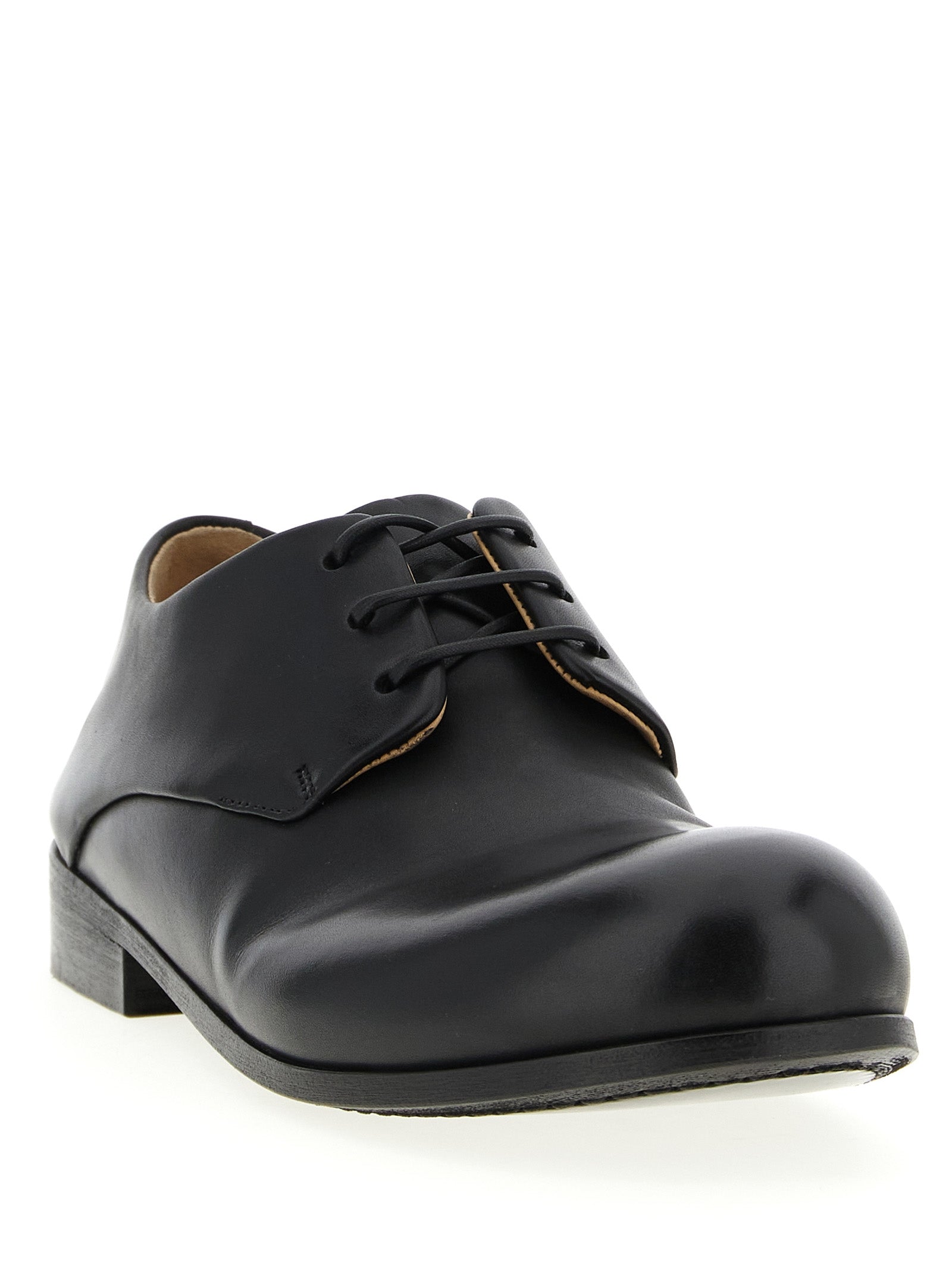 Derby Shoes by Marsell for men in bos taurus calfskin leather black features an effortless chic silhouette, showcasing the Men's Bos Taurus Calfskin Leather Derby Shoes design with an effortless chic and a for a effortless chic look.