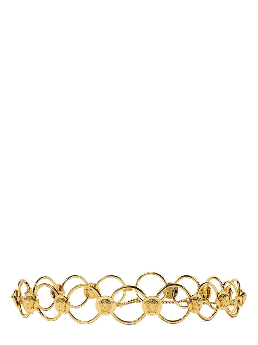 Belt by Versace for women in brass gold features a versatile silhouette, artfully showcasing the versatile design of the Medusa Brass Belt for a sophisticated, premium finish.
