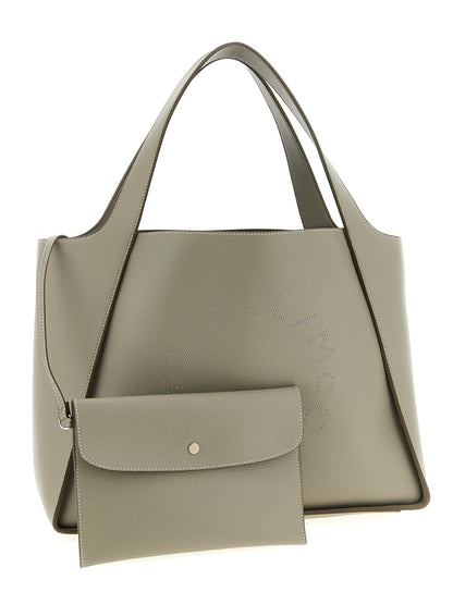 This Shopper Tote Clutch Bag by Stella McCartney for women in polyamide beige features an jet-set Logo Bag Polyamide Shopper Tote Clutch design with a secure , ample , and jet-set detachable-strap & handle.