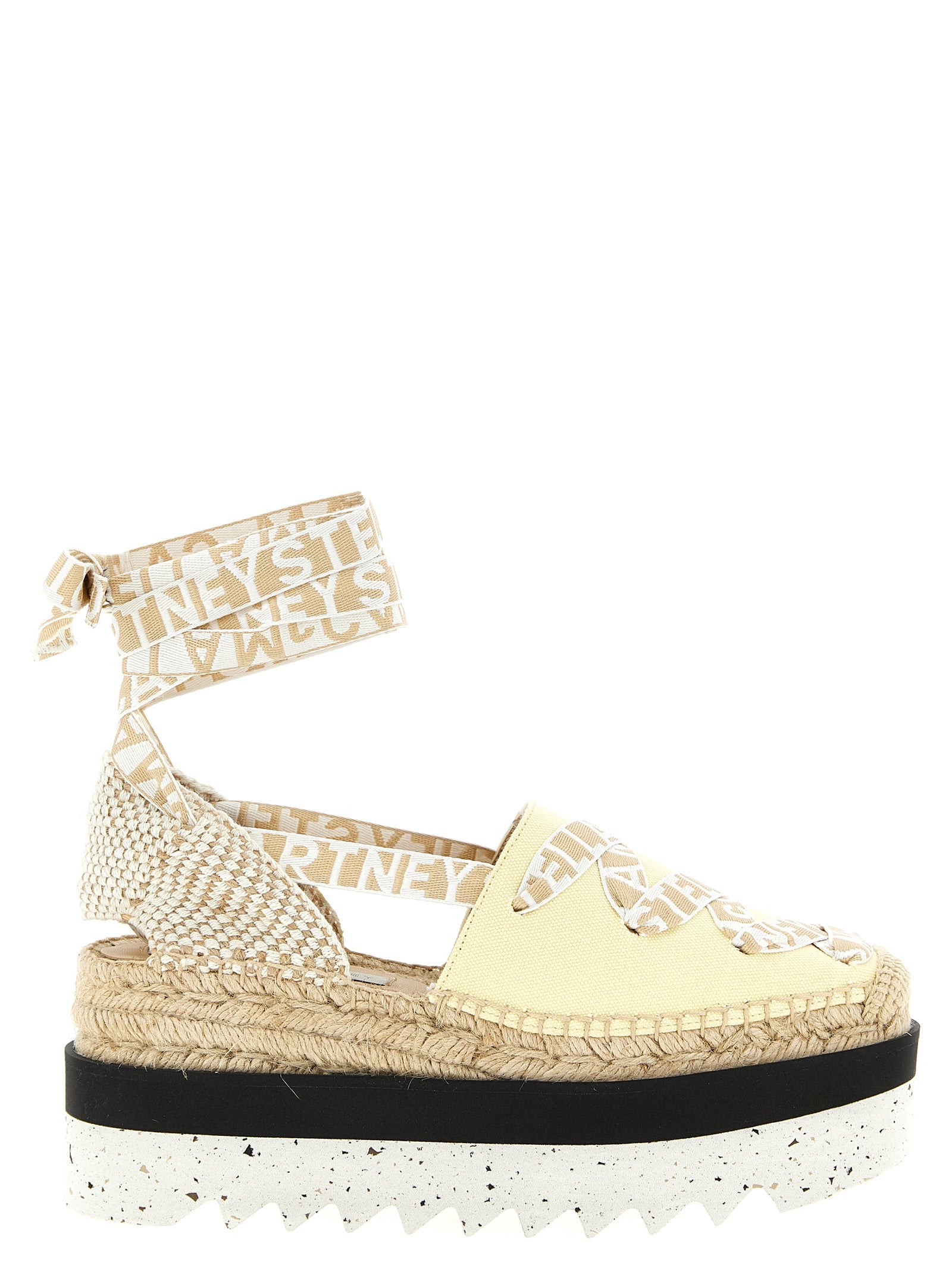 Wedge Sandals by Stella McCartney for women in raffia viscose canvas & faux leather bicolour & yellow features an statuesque Women's Raffia Viscose Canvas & Faux Leather Wedge Sandals silhouette with a refined wedge and elegant .