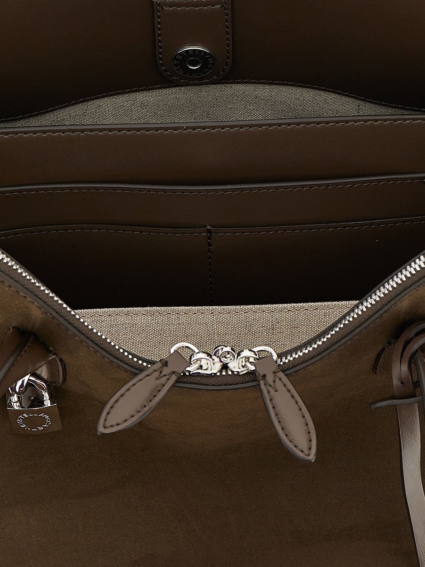 Shoulder Bag by Stella McCartney for women in faux polyester fur brown showcases a statuesque silhouette, artfully detailed with a secure snap & zipper, organized , and versatile shoulder-strap & handle for a statuesque look.