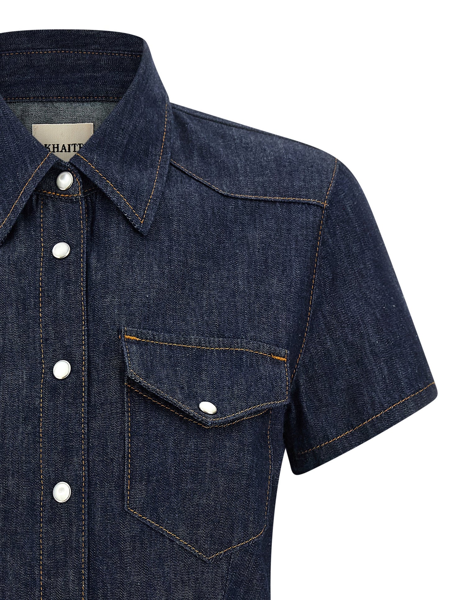 Blouse by Khaite for women in denim cotton blue showcases a sharp silhouette, elegantly detailed with a sharp and sharp .