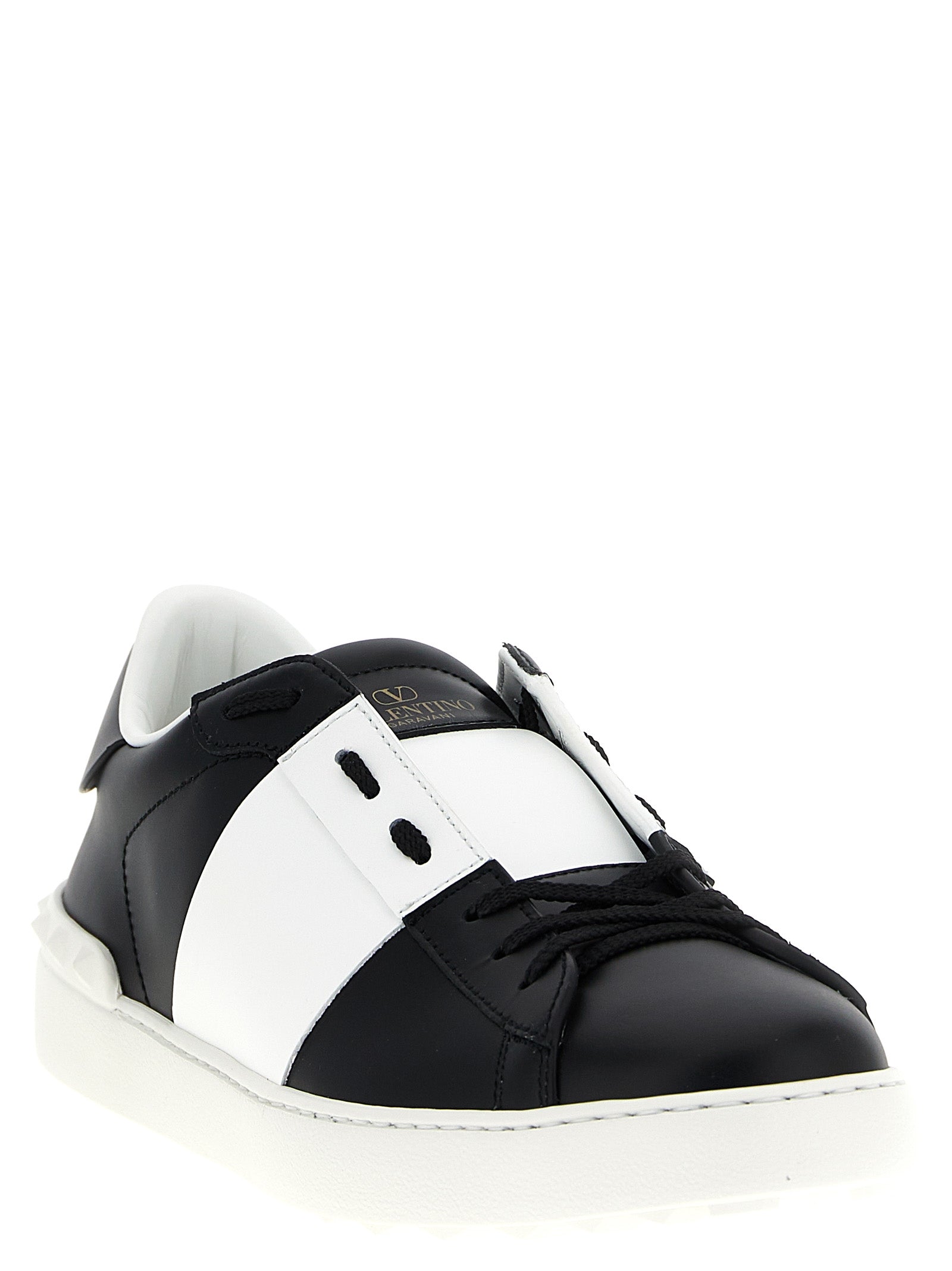 Sneakers by Valentino Garavani for men in calfskin leather bicolour, black, white & signature presents a on trend silhouette from the Men's Fashion Calfskin Leather Sneakers collection, showcasing a on trend fashion style for an elevated aesthetic.