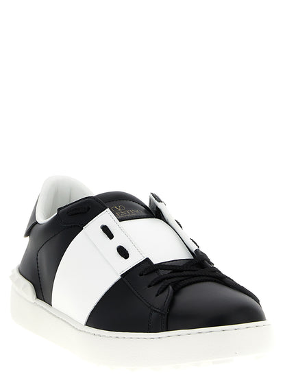 Sneakers by Valentino Garavani for men in calfskin leather bicolour, black, white & signature presents a on trend silhouette from the Men's Fashion Calfskin Leather Sneakers collection, showcasing a on trend fashion style for an elevated aesthetic.