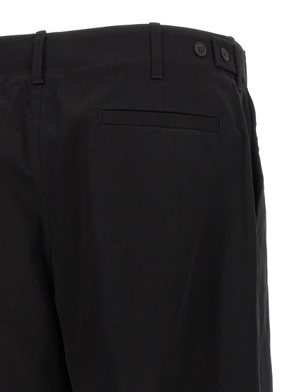 Chinos Pants by Fendi for men in stretch cotton black features an sharp and long with a , highlighting a sharp silhouette for a sophisticated look.