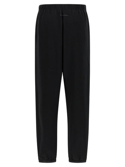 Joggers by MM6 Maison Margiela for women in cotton black & print features an refined tailoring silhouette, showcasing a premium with a and long cut for a refined tailoring look.